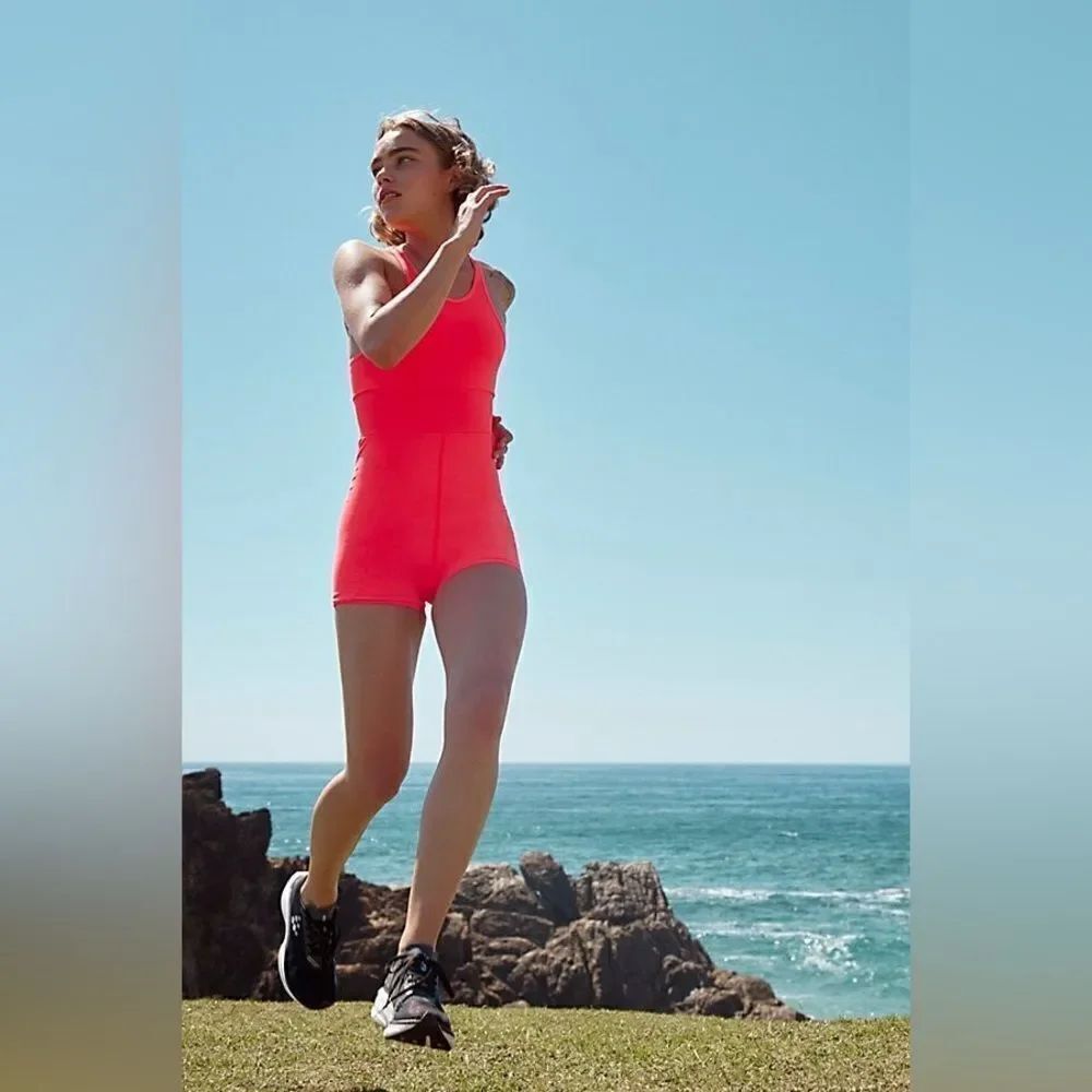 Free People Movement Every Single Time Runsie Athletic Romper Stretch Coral